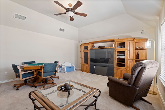living room featuring visible vents, a ceiling fan, lofted ceiling, and light colored carpet