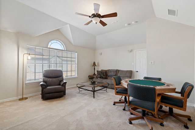 interior space with visible vents, carpet, vaulted ceiling, and plenty of natural light