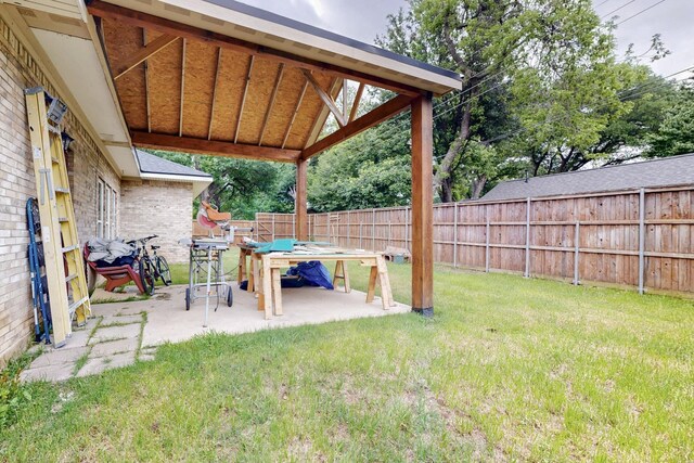 view of yard with a fenced backyard and a patio area