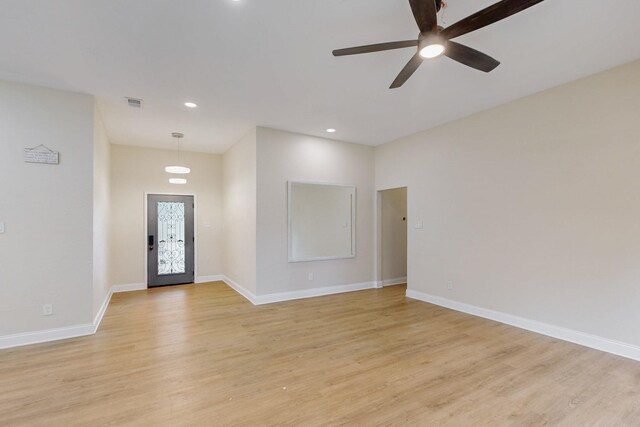 foyer featuring light wood-style floors, baseboards, ceiling fan, and recessed lighting