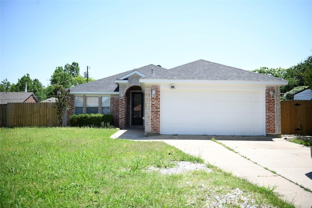 148 E Marguerita Dr, Garland, TX 75040 - kitchen featuring gas stove, stainless steel microwave, light wood-type flooring, a sink, and white cabinets