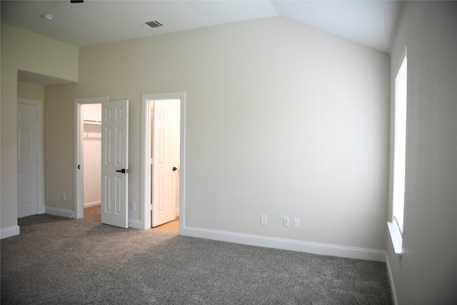 148 E Marguerita Dr, Garland, TX 75040 - unfurnished room with dark carpet, baseboards, and vaulted ceiling