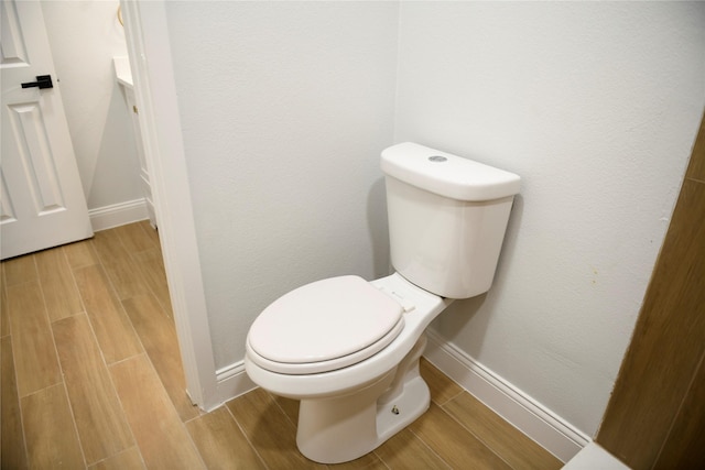 148 E Marguerita Dr, Garland, TX 75040 - bathroom featuring baseboards, wood finished floors, and vanity