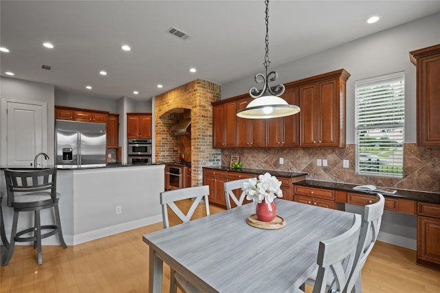 dining area featuring visible vents, recessed lighting, and light wood-style floors