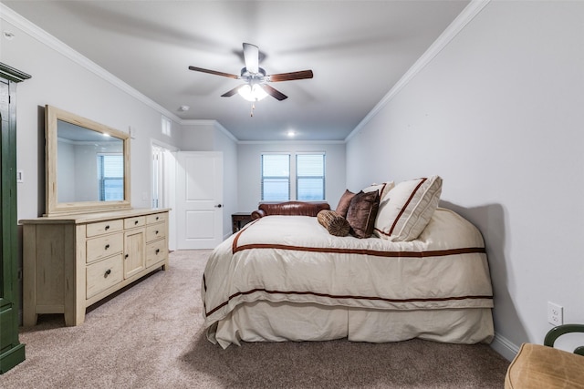 bedroom with crown molding, a ceiling fan, and light colored carpet