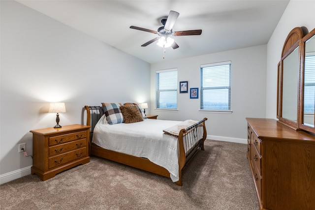 bedroom with baseboards, ceiling fan, and dark colored carpet