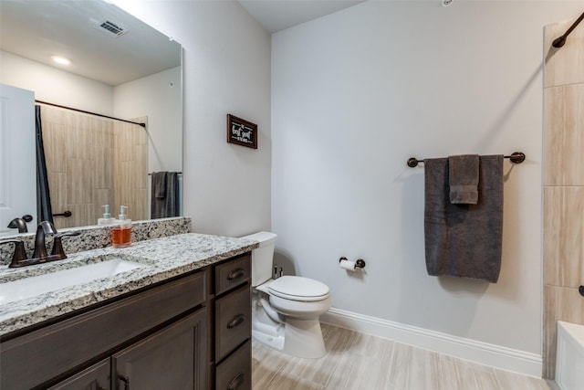 bathroom featuring vanity, toilet, a shower with shower curtain, baseboards, and visible vents