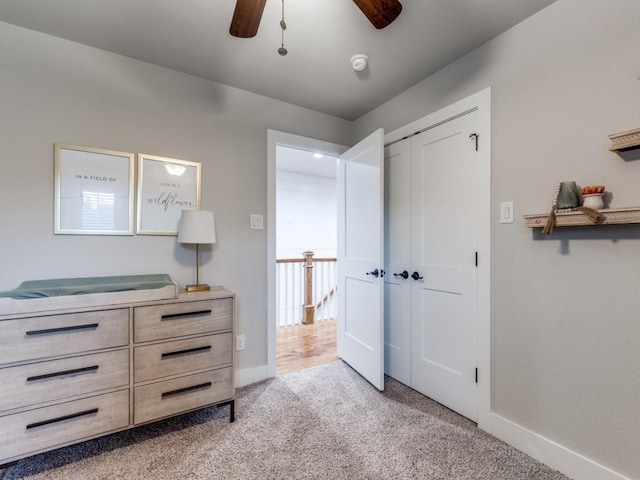 laundry room featuring dark tile patterned floors, cabinet space, and washer and dryer