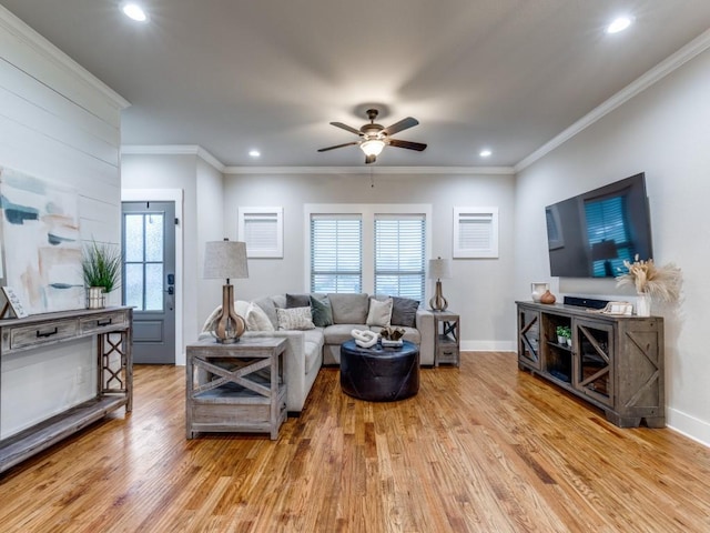 living room featuring a ceiling fan, recessed lighting, ornamental molding, and wood finished floors