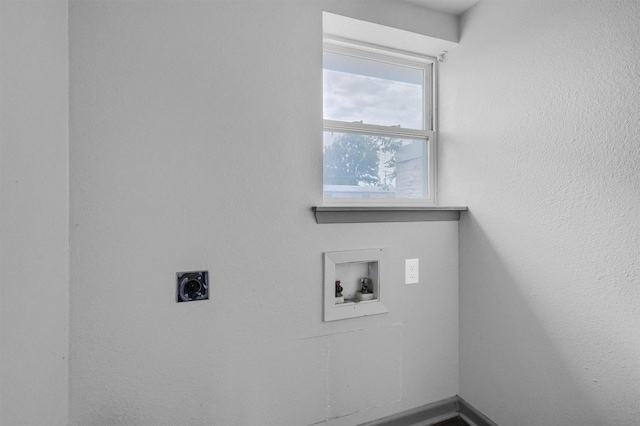 laundry area with electric dryer hookup, hookup for a washing machine, and laundry area