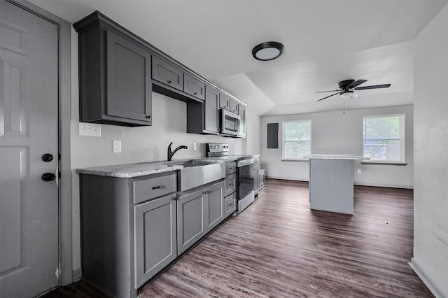 kitchen with gray cabinetry, a ceiling fan, appliances with stainless steel finishes, and dark wood-style floors