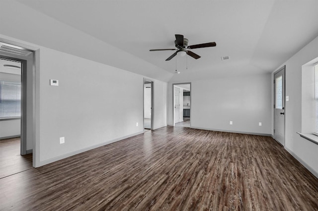 unfurnished living room featuring baseboards, ceiling fan, dark wood finished floors, and visible vents