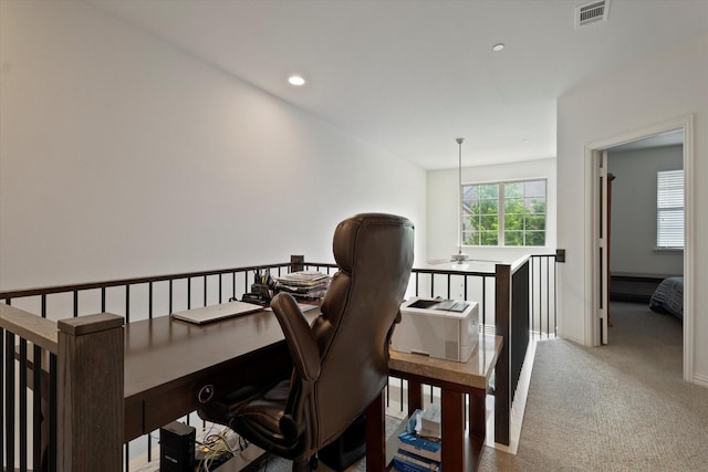 interior space with carpet floors, recessed lighting, baseboards, an upstairs landing, and visible vents