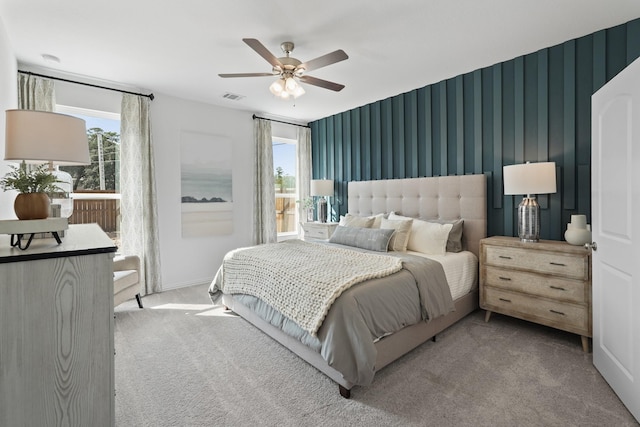bedroom with multiple windows, carpet, and visible vents