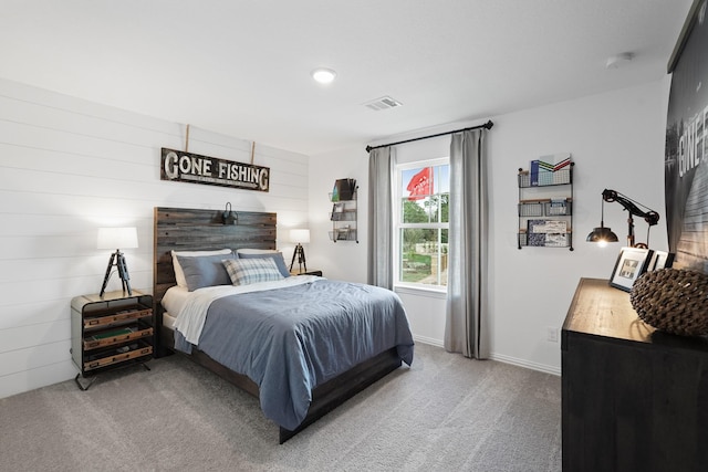 bedroom featuring visible vents, carpet flooring, and baseboards
