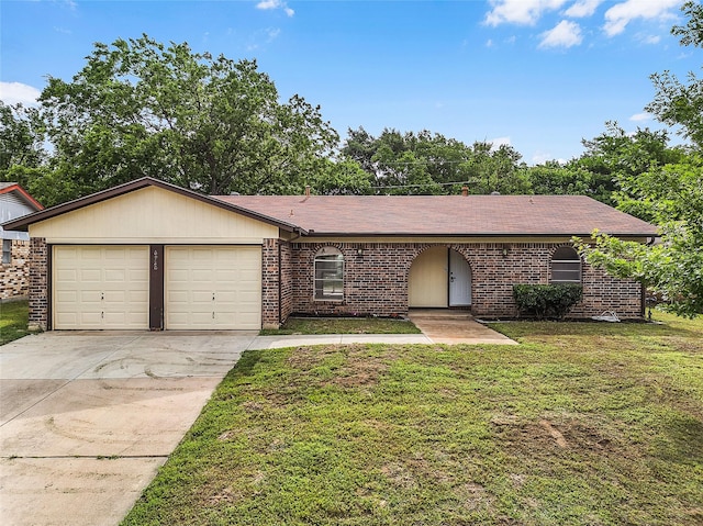 ranch-style home featuring a garage, a front lawn, roof with shingles, brick siding, and concrete driveway
