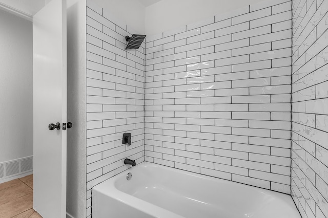bathroom featuring shower / bathtub combination, tile patterned floors, and visible vents