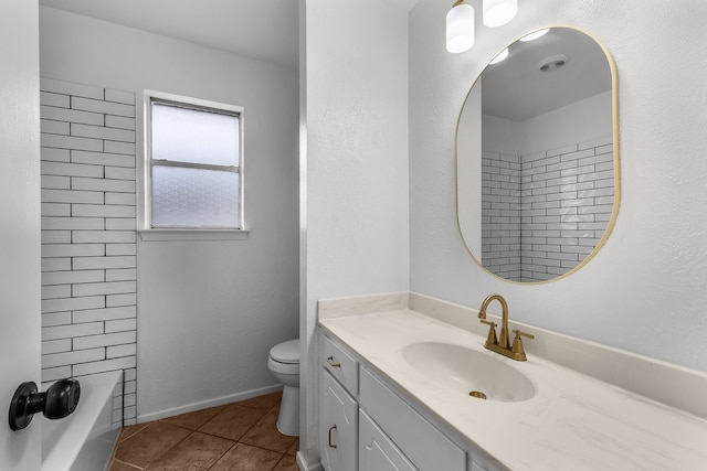 bathroom featuring toilet, baseboards, tile patterned flooring, and vanity