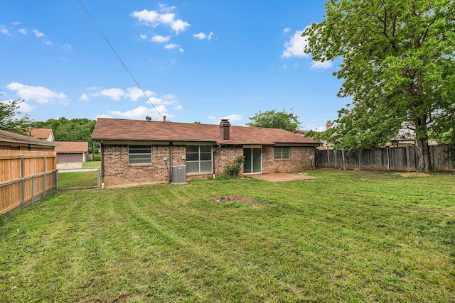 rear view of house with central AC, a fenced backyard, brick siding, a patio area, and a lawn