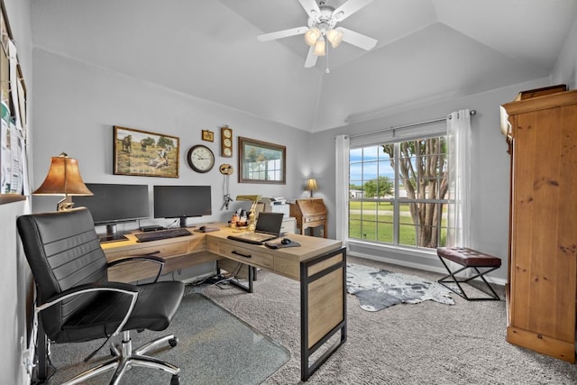 carpeted home office featuring baseboards, ceiling fan, and lofted ceiling