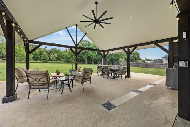 view of patio / terrace with a ceiling fan, fence, and an outdoor hangout area