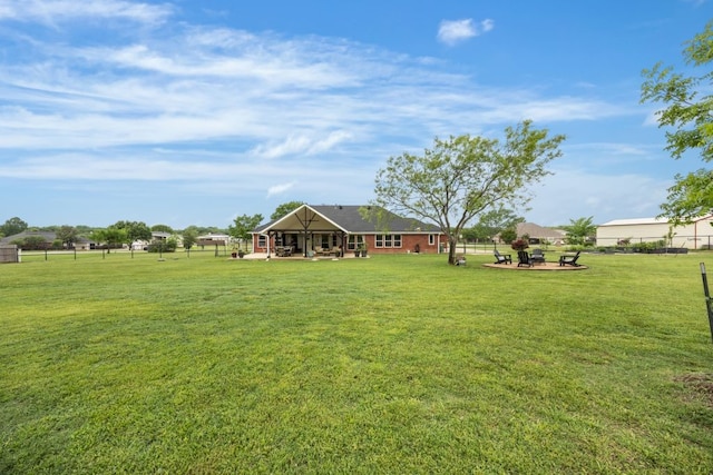 view of yard with a patio and fence