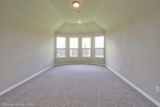 empty room with visible vents, carpet flooring, and baseboards