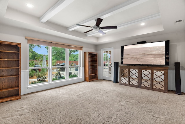 carpeted empty room featuring ceiling fan, a tray ceiling, recessed lighting, beamed ceiling, and visible vents