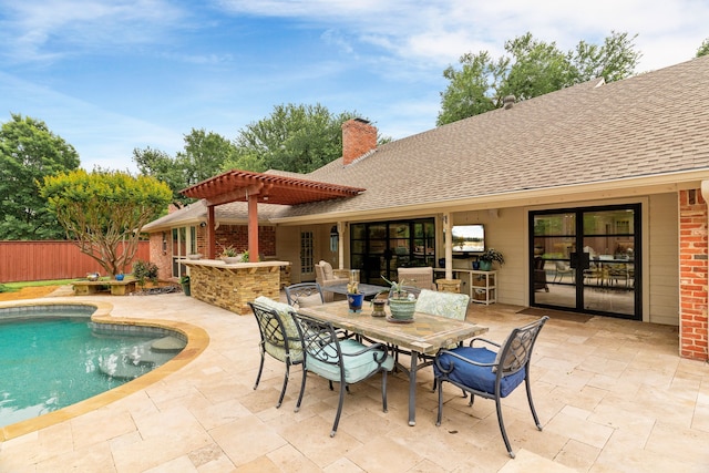 view of swimming pool featuring fence, a pergola, a fenced in pool, outdoor dining area, and a patio area