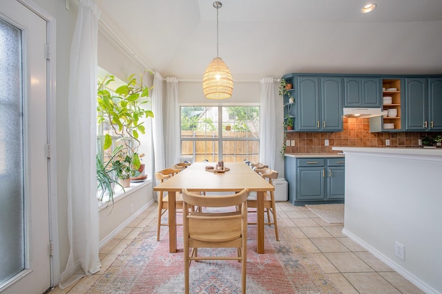 dining space featuring baseboards and light tile patterned floors