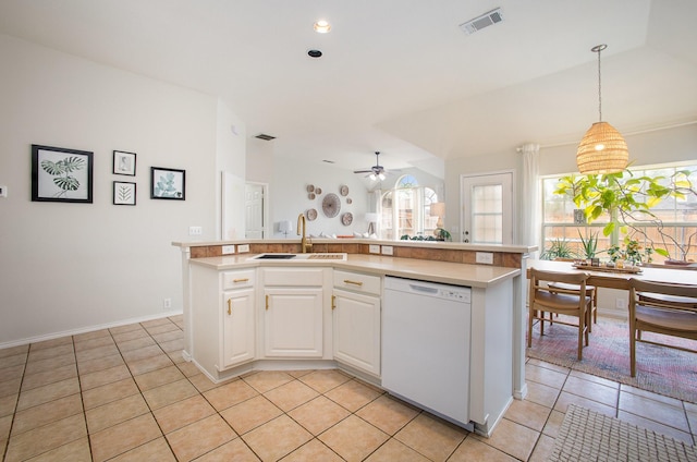 kitchen with light tile patterned flooring, visible vents, a sink, and dishwasher