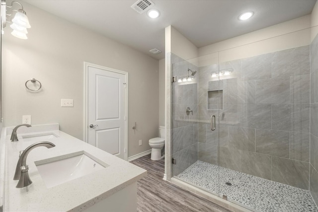343 Preston Rd, Mabank, TX 75147 - full bathroom with a sink, wood finished floors, toilet, and a stall shower