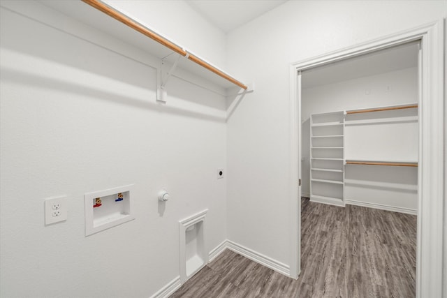 343 Preston Rd, Mabank, TX 75147 - clothes washing area featuring laundry area, gas dryer hookup, baseboards, electric dryer hookup, and wood finished floors