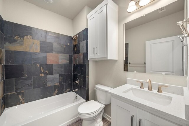 343 Preston Rd, Mabank, TX 75147 - full bathroom with vanity, visible vents, wood finished floors, toilet, and shower / washtub combination