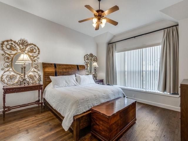 bedroom with baseboards, a ceiling fan, dark wood-style flooring, and lofted ceiling