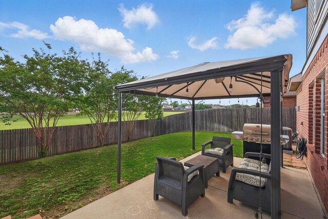 view of patio / terrace featuring area for grilling, a gazebo, an outdoor hangout area, and a fenced backyard