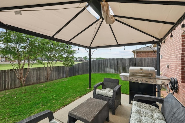 view of patio / terrace featuring a fenced backyard, an outdoor hangout area, and area for grilling