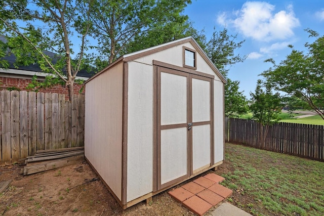 view of shed featuring a fenced backyard