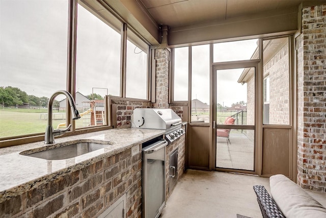 sunroom with a sink