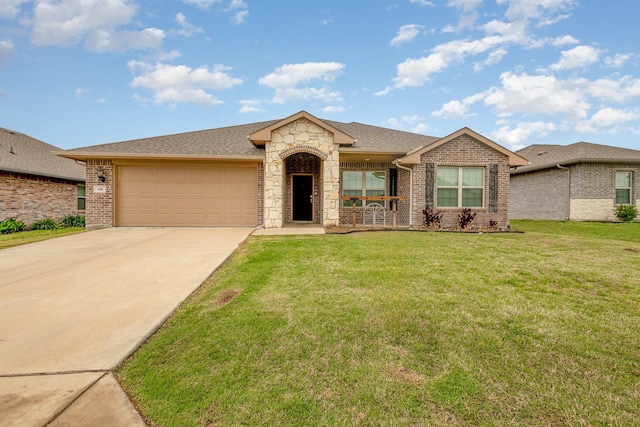 146 Willowbend Loop, Mabank, TX 75156 - ranch-style home with brick siding, a front lawn, concrete driveway, an attached garage, and stone siding