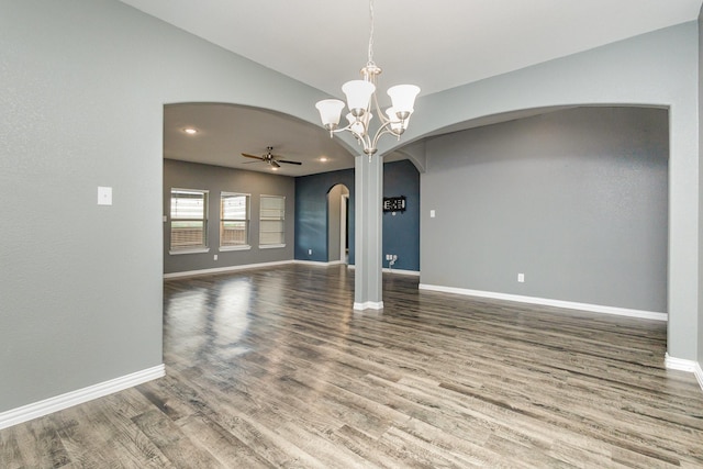 146 Willowbend Loop, Mabank, TX 75156 - interior space featuring arched walkways, ceiling fan with notable chandelier, baseboards, wood finished floors, and vaulted ceiling