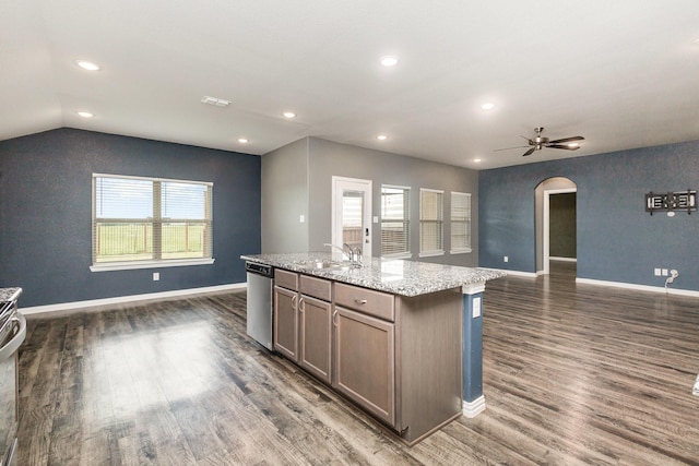 146 Willowbend Loop, Mabank, TX 75156 - kitchen featuring open floor plan, arched walkways, dark wood-style floors, and stainless steel appliances