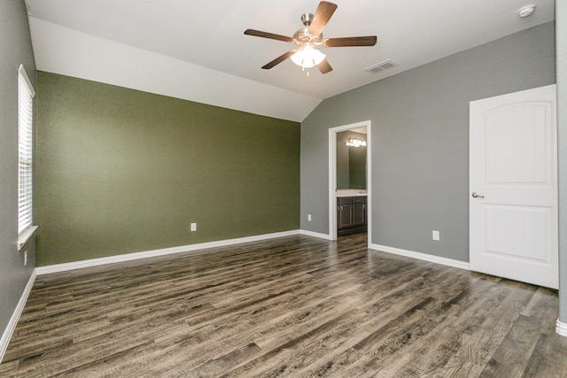 146 Willowbend Loop, Mabank, TX 75156 - unfurnished bedroom with visible vents, vaulted ceiling, baseboards, dark wood-style floors, and ensuite bathroom