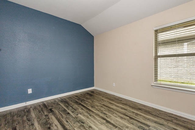 146 Willowbend Loop, Mabank, TX 75156 - unfurnished room featuring baseboards, dark wood finished floors, and vaulted ceiling