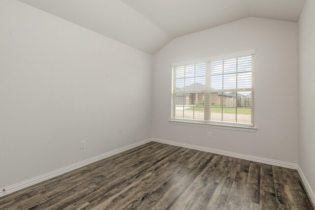 146 Willowbend Loop, Mabank, TX 75156 - spare room with dark wood-style flooring, baseboards, and vaulted ceiling