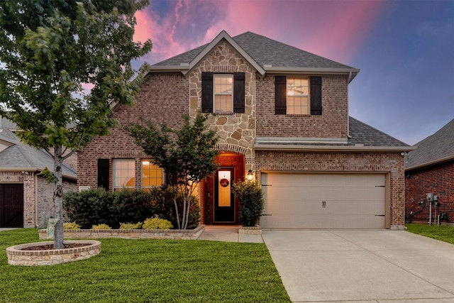 traditional home with brick siding, driveway, and a yard