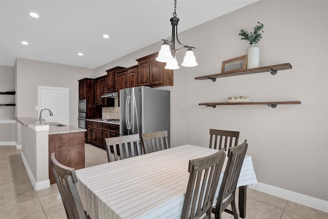 dining area featuring a chandelier, baseboards, light tile patterned floors, and recessed lighting