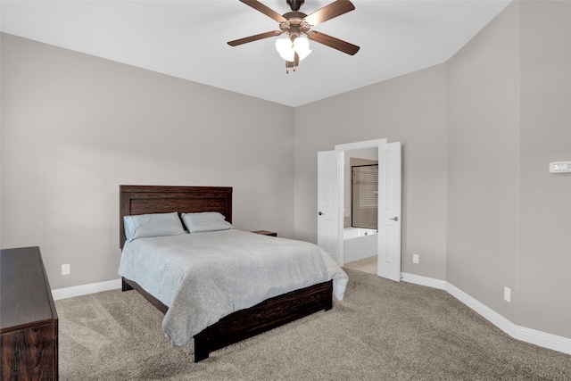 bedroom featuring baseboards, light carpet, and connected bathroom