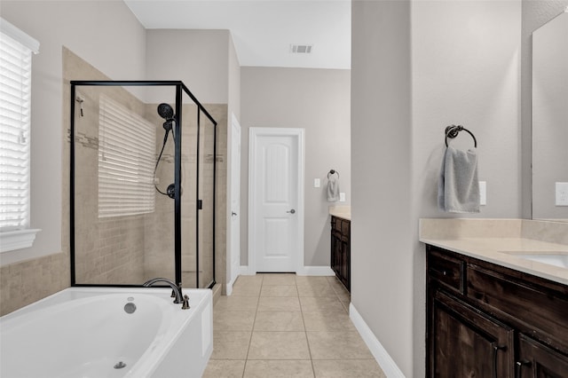 bathroom with vanity, visible vents, a stall shower, tile patterned flooring, and a garden tub