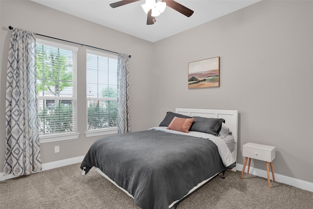 bedroom featuring carpet floors, baseboards, and a ceiling fan